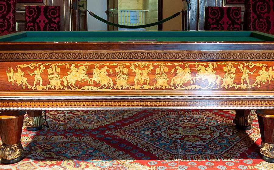 Hand-carved antique hardwood billiard table with inlaid panels