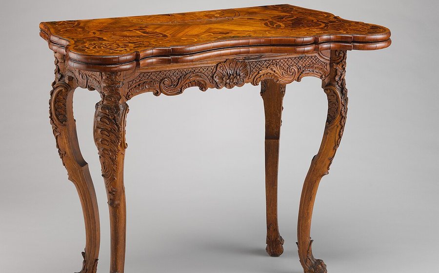 Carved hardwood card/game table (representative photo)