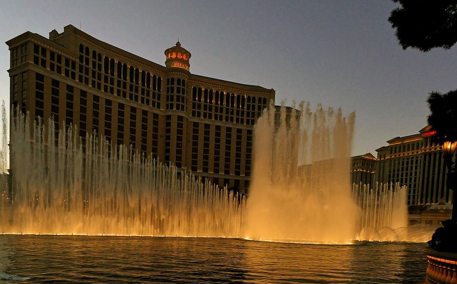 Bellagio fountains and Strip resort towers at night